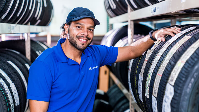 JM Lexus Associate next to tire rack